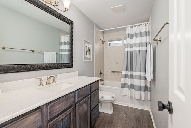 7901 Cross Plains Dr, Plano, TX 75025 - bathroom with wood finished floors, shower / bath combo with shower curtain, vanity, and toilet