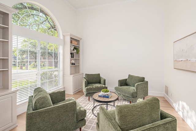7901 Cross Plains Dr, Plano, TX 75025 - sitting room featuring healthy amount of natural light, crown molding, light wood-style floors, and baseboards