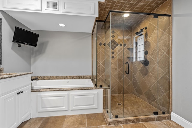 7125 Fish Pond Rd, Waco, TX 76710 - bathroom featuring a garden tub, a shower stall, vanity, and recessed lighting