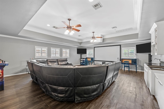 7125 Fish Pond Rd, Waco, TX 76710 - living area featuring a tray ceiling, ceiling fan, dark wood-style flooring, ornamental molding, and recessed lighting