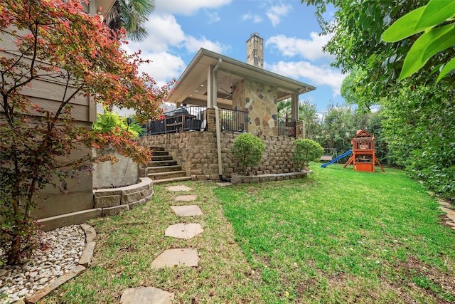 7125 Fish Pond Rd, Waco, TX 76710 - view of green lawn with stairway, a playground, and ceiling fan