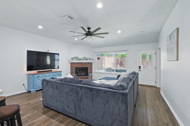 1010 Greenbriar Ln, Mckinney, TX 75069 - living room featuring dark wood-style flooring, a ceiling fan, recessed lighting, baseboards, and a textured ceiling