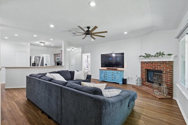 1010 Greenbriar Ln, Mckinney, TX 75069 - living room with a ceiling fan, dark wood-style floors, baseboards, recessed lighting, and a textured ceiling