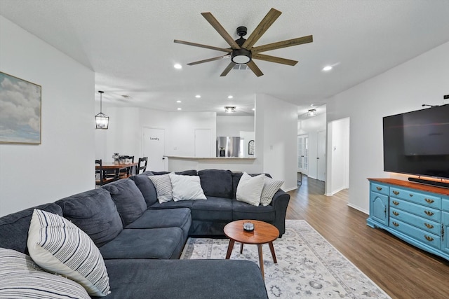 1010 Greenbriar Ln, Mckinney, TX 75069 - living area featuring dark wood-style floors, ceiling fan, recessed lighting, and baseboards