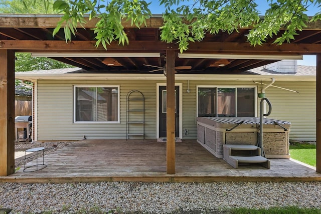1010 Greenbriar Ln, Mckinney, TX 75069 - rear view of house with a hot tub and a wooden deck