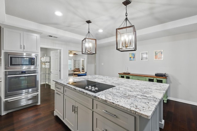 3713 Collinwood Ave, Fort Worth, TX 76107 - kitchen featuring stainless steel appliances, a warming drawer, baseboards, a chandelier, and dark wood-style flooring