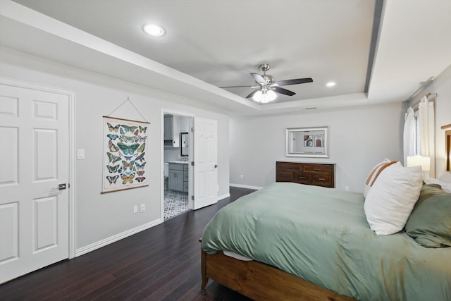 3713 Collinwood Ave, Fort Worth, TX 76107 - bedroom featuring baseboards, dark wood-style floors, a raised ceiling, recessed lighting, and ensuite bath