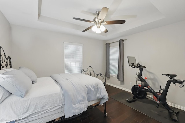 3713 Collinwood Ave, Fort Worth, TX 76107 - bedroom featuring a raised ceiling, dark wood-style floors, baseboards, and ceiling fan