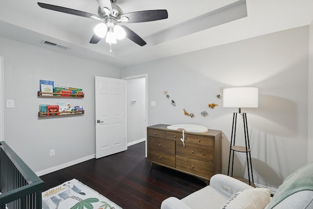 3713 Collinwood Ave, Fort Worth, TX 76107 - bedroom with dark wood-type flooring, baseboards, a tray ceiling, and ceiling fan