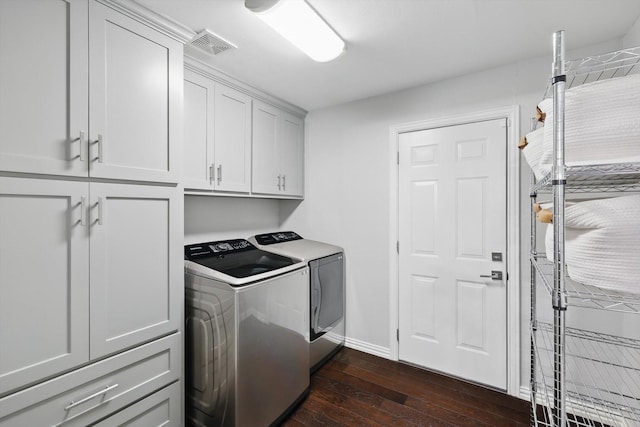 3713 Collinwood Ave, Fort Worth, TX 76107 - laundry room featuring cabinet space, washer and dryer, dark wood-style floors, and baseboards