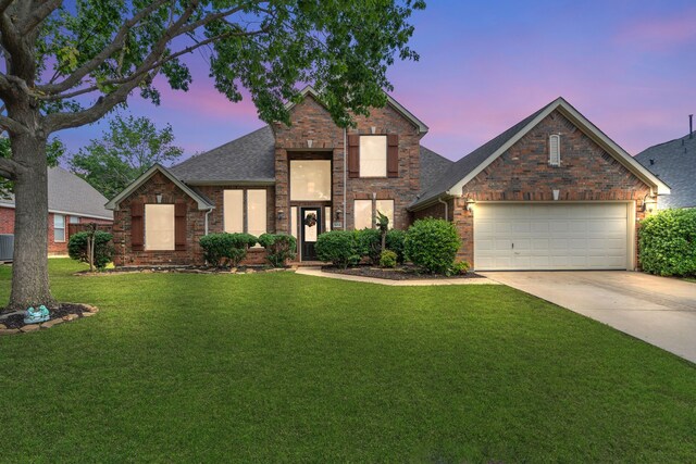 1804 Morning Mist Trl, Flower Mound, TX 75028 - view of front of property featuring driveway, a garage, a front lawn, brick siding, and roof with shingles