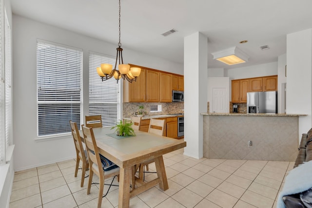 1804 Morning Mist Trl, Flower Mound, TX 75028 - dining room featuring a chandelier and light tile patterned floors