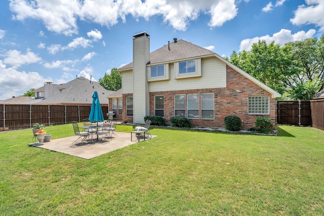 1804 Morning Mist Trl, Flower Mound, TX 75028 - back of property with a fenced backyard, brick siding, a patio area, and a chimney