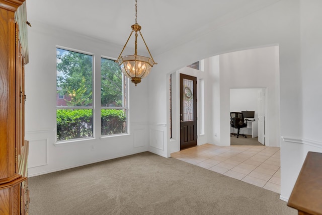 1804 Morning Mist Trl, Flower Mound, TX 75028 - spare room featuring a chandelier, light colored carpet, light tile patterned floors, and a desk