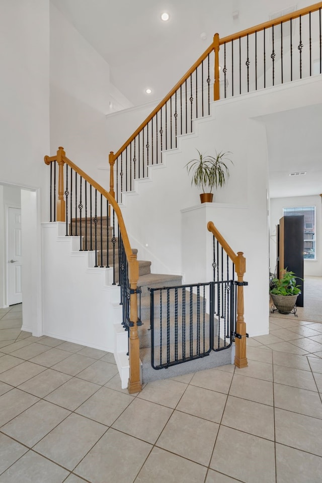 1804 Morning Mist Trl, Flower Mound, TX 75028 - stairway featuring a high ceiling, tile patterned floors, and recessed lighting