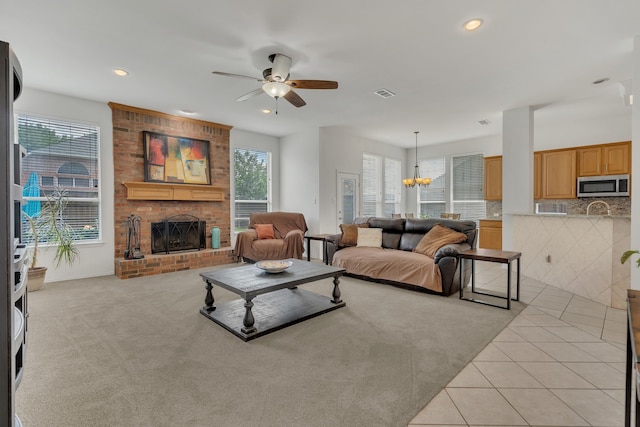 1804 Morning Mist Trl, Flower Mound, TX 75028 - living area with light colored carpet, a fireplace, ceiling fan, recessed lighting, and light tile patterned floors