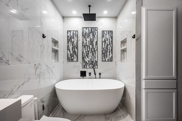 4242 N Capistrano Dr Unit 174, Dallas, TX 75287 - full bath with marble tiled flooring, tile walls, a freestanding tub, toilet, and recessed lighting