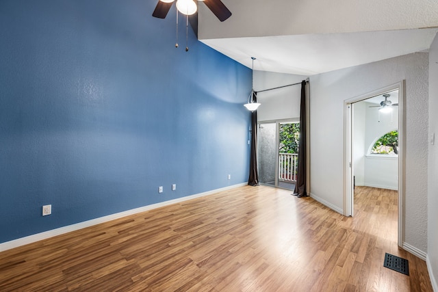 4242 N Capistrano Dr Unit 174, Dallas, TX 75287 - spare room featuring a ceiling fan, vaulted ceiling, baseboards, and wood finished floors