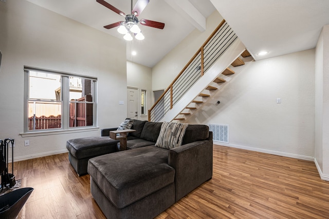 4242 N Capistrano Dr Unit 174, Dallas, TX 75287 - living area with wood finished floors, ceiling fan, baseboards, stairs, and a high ceiling