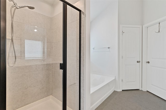 9220 Nevis Dr, Fort Worth, TX 76123 - full bath with a stall shower, a garden tub, and tile patterned flooring