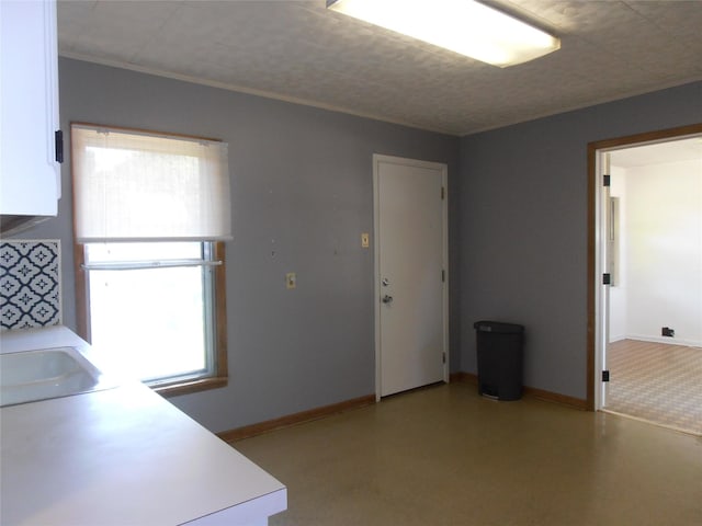 2108 Norwood Ln, Arlington, TX 76013 - kitchen with plenty of natural light, light countertops, and baseboards