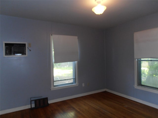 2108 Norwood Ln, Arlington, TX 76013 - unfurnished room with wood finished floors and baseboards