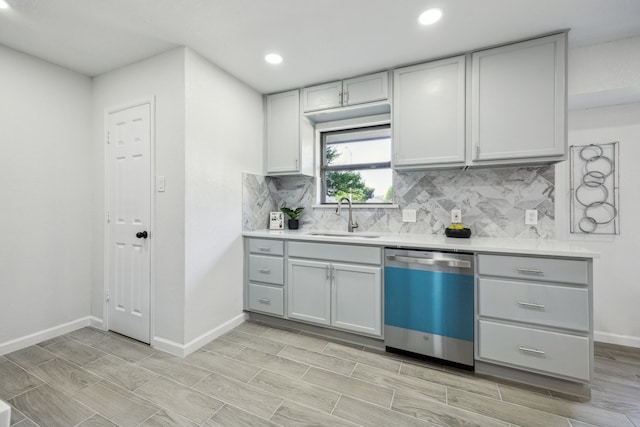 101 Oakmont Dr, Trophy Club, TX 76262 - kitchen with dishwasher, a sink, backsplash, light countertops, and baseboards