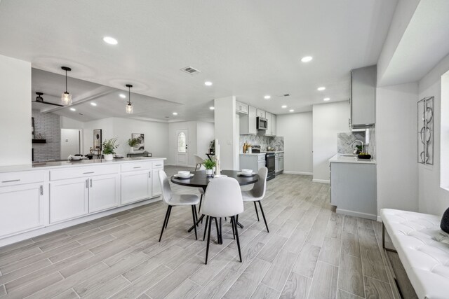 101 Oakmont Dr, Trophy Club, TX 76262 - dining room with light wood finished floors, recessed lighting, and baseboards