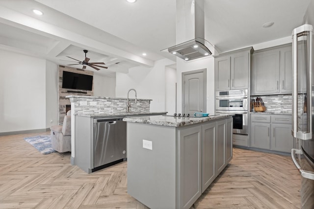 3304 Cobbler Ln, Joshua, TX 76058 - kitchen with gray cabinetry, a kitchen island with sink, appliances with stainless steel finishes, extractor fan, and recessed lighting