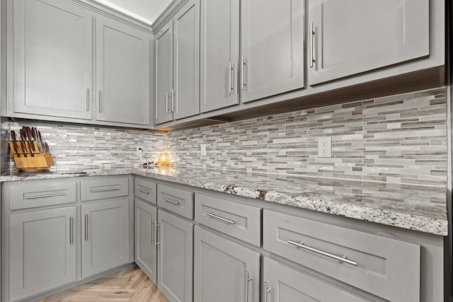 3304 Cobbler Ln, Joshua, TX 76058 - kitchen with gray cabinets, tasteful backsplash, and light stone counters