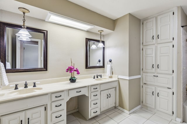 full bathroom featuring double vanity and tile patterned flooring