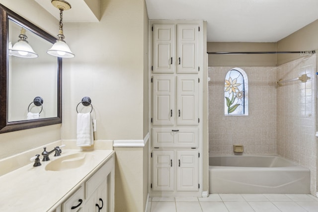 full bath with tile patterned floors, vanity, and bathing tub / shower combination