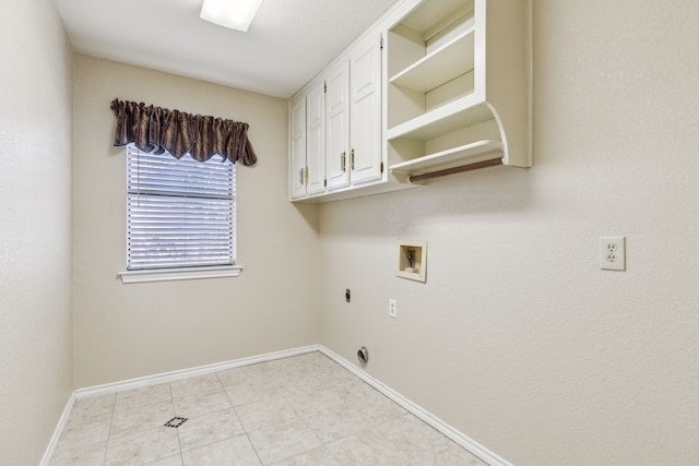 clothes washing area featuring hookup for an electric dryer, cabinet space, hookup for a washing machine, baseboards, and light tile patterned floors