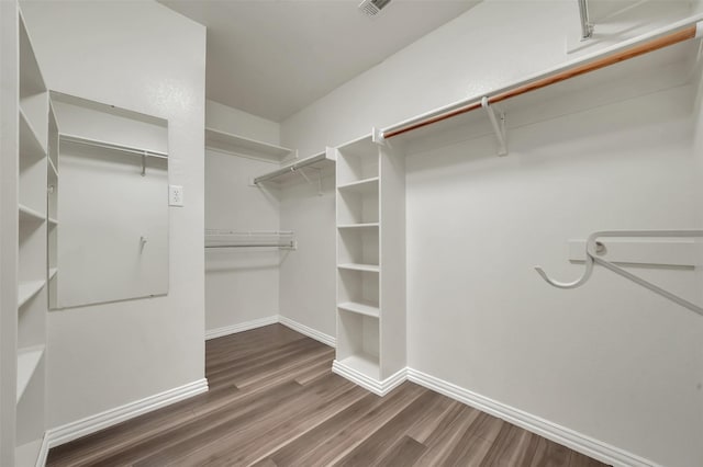 spacious closet with wood finished floors
