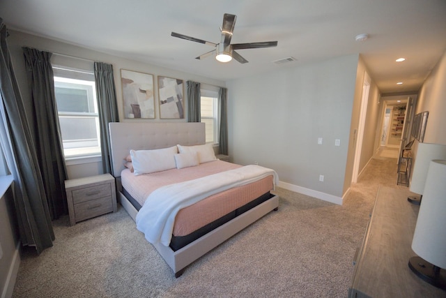 bedroom with light carpet, recessed lighting, a ceiling fan, and baseboards
