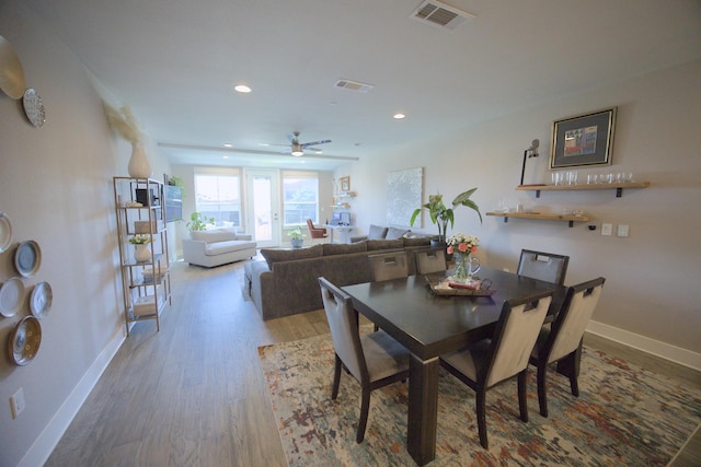 dining room featuring wood finished floors, baseboards, a ceiling fan, and recessed lighting