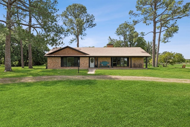 2173 Fairway Acres Dr, Argyle, TX 76226 - ranch-style home featuring a front lawn, a chimney, and brick siding