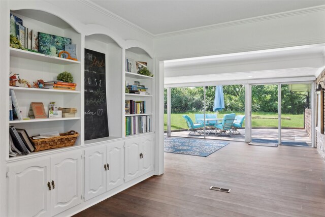 2173 Fairway Acres Dr, Argyle, TX 76226 - hall featuring crown molding, dark wood-style floors, and built in shelves