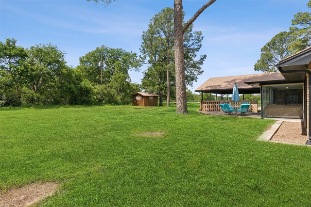 2173 Fairway Acres Dr, Argyle, TX 76226 - view of green lawn with a storage shed, an outbuilding, and a patio