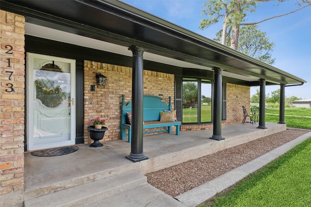 2173 Fairway Acres Dr, Argyle, TX 76226 - doorway to property featuring covered porch and brick siding