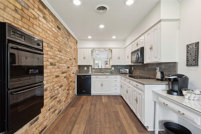 2173 Fairway Acres Dr, Argyle, TX 76226 - kitchen featuring black appliances, brick wall, a sink, white cabinetry, and dark wood-style floors