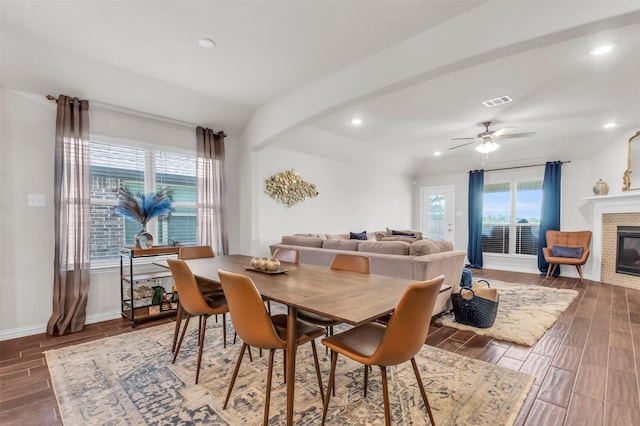 2125 Swanmore Way, Forney, TX 75126 - dining area featuring plenty of natural light, a glass covered fireplace, wood finished floors, and recessed lighting