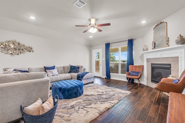 2125 Swanmore Way, Forney, TX 75126 - living room with dark wood-style flooring, a ceiling fan, recessed lighting, a tiled fireplace, and baseboards