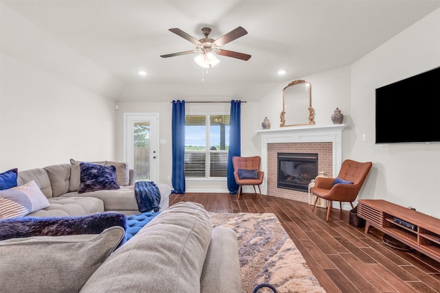 2125 Swanmore Way, Forney, TX 75126 - living room with dark wood-type flooring, a brick fireplace, ceiling fan, and recessed lighting