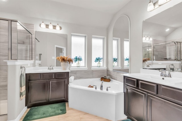 2125 Swanmore Way, Forney, TX 75126 - full bath featuring a shower stall, a garden tub, two vanities, and vaulted ceiling