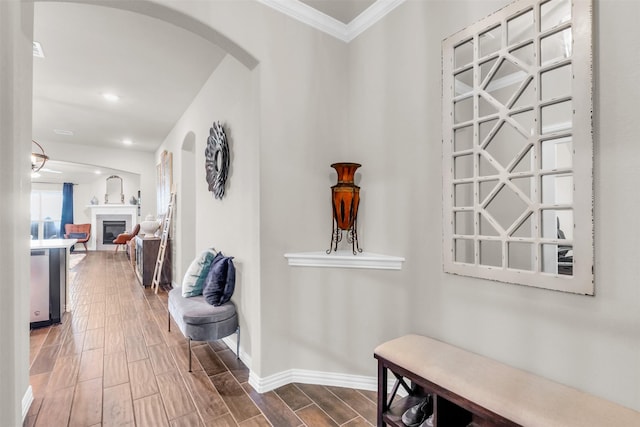 2125 Swanmore Way, Forney, TX 75126 - hall with arched walkways, crown molding, wood finished floors, baseboards, and recessed lighting