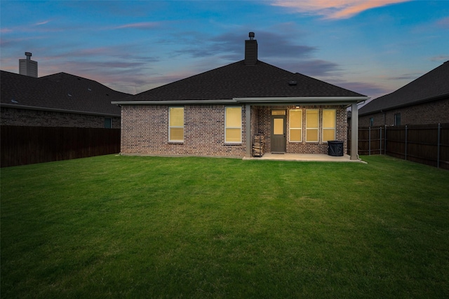 3129 Greymoore Dr, Anna, TX 75409 - back of property with a patio area, brick siding, a chimney, and a shingled roof