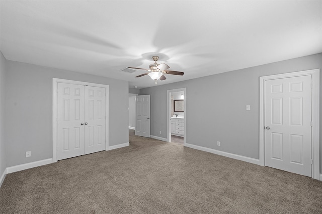 4016 Austin Ave, Waco, TX 76710 - unfurnished bedroom with carpet floors, baseboards, a closet, a ceiling fan, and ensuite bath