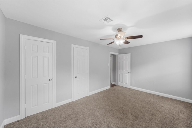 4016 Austin Ave, Waco, TX 76710 - unfurnished bedroom featuring carpet flooring, baseboards, and a ceiling fan