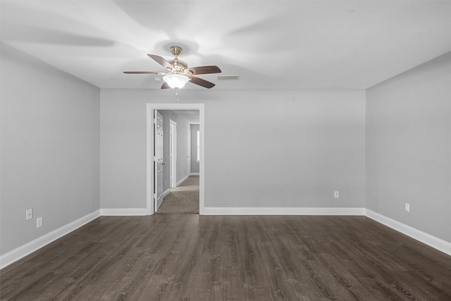 4016 Austin Ave, Waco, TX 76710 - unfurnished room with dark wood finished floors, baseboards, and a ceiling fan